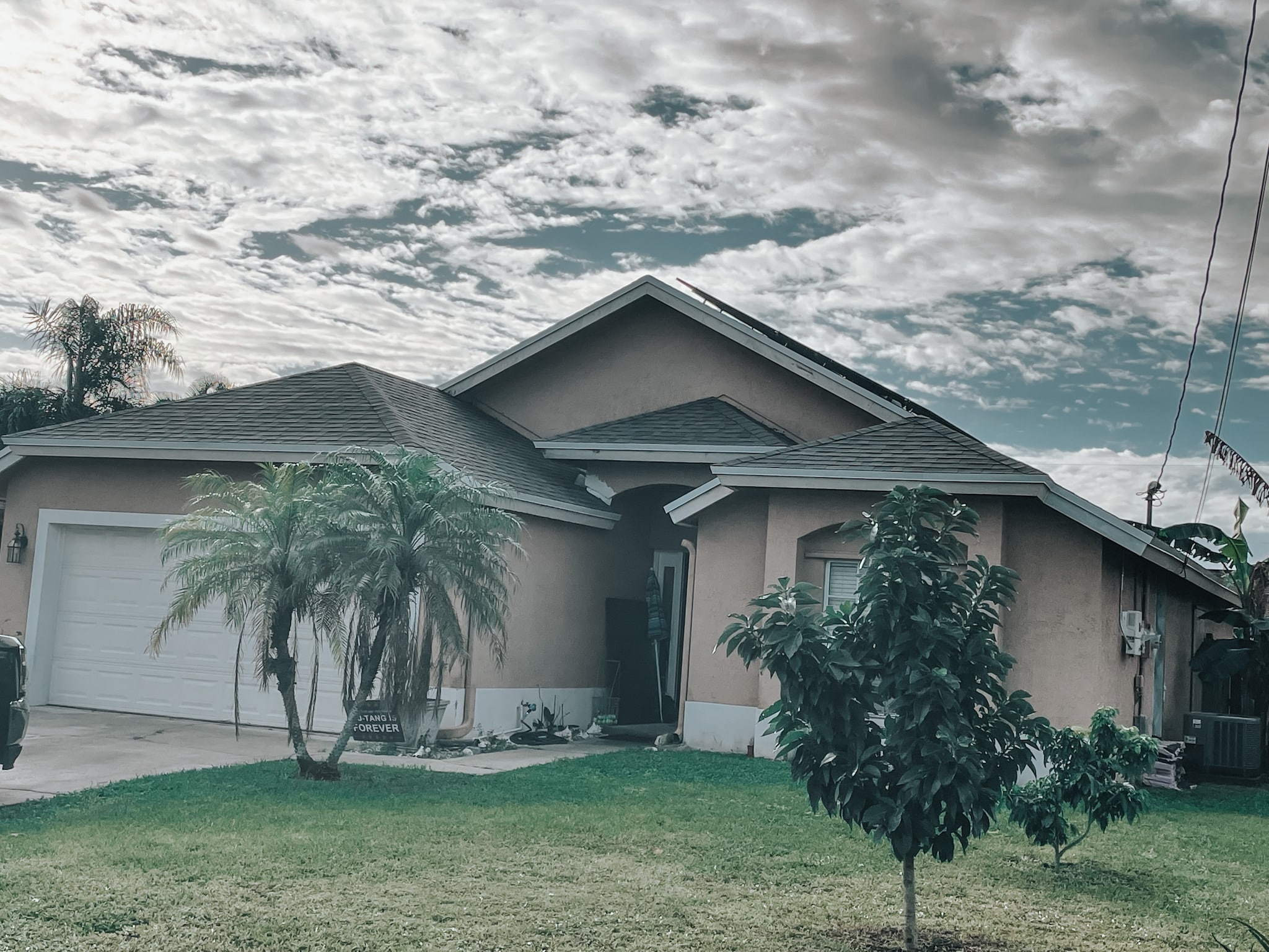 Completed dark Segmental Block Walls retaining wall on a TX home